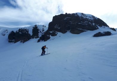 Local Skier skinning up to Cota-9 using another route inbetween the normal route and the East side of the cliff band